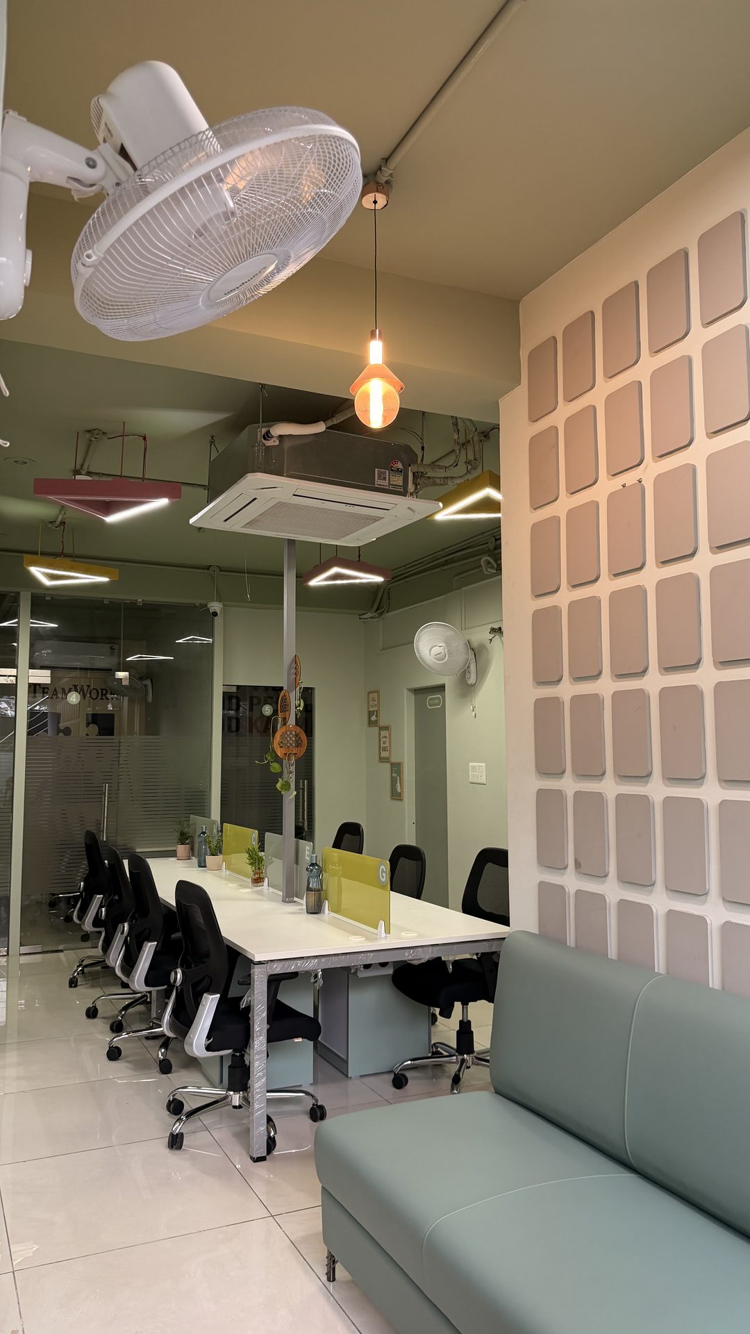 Karmhut common area lounge with textured feature wall