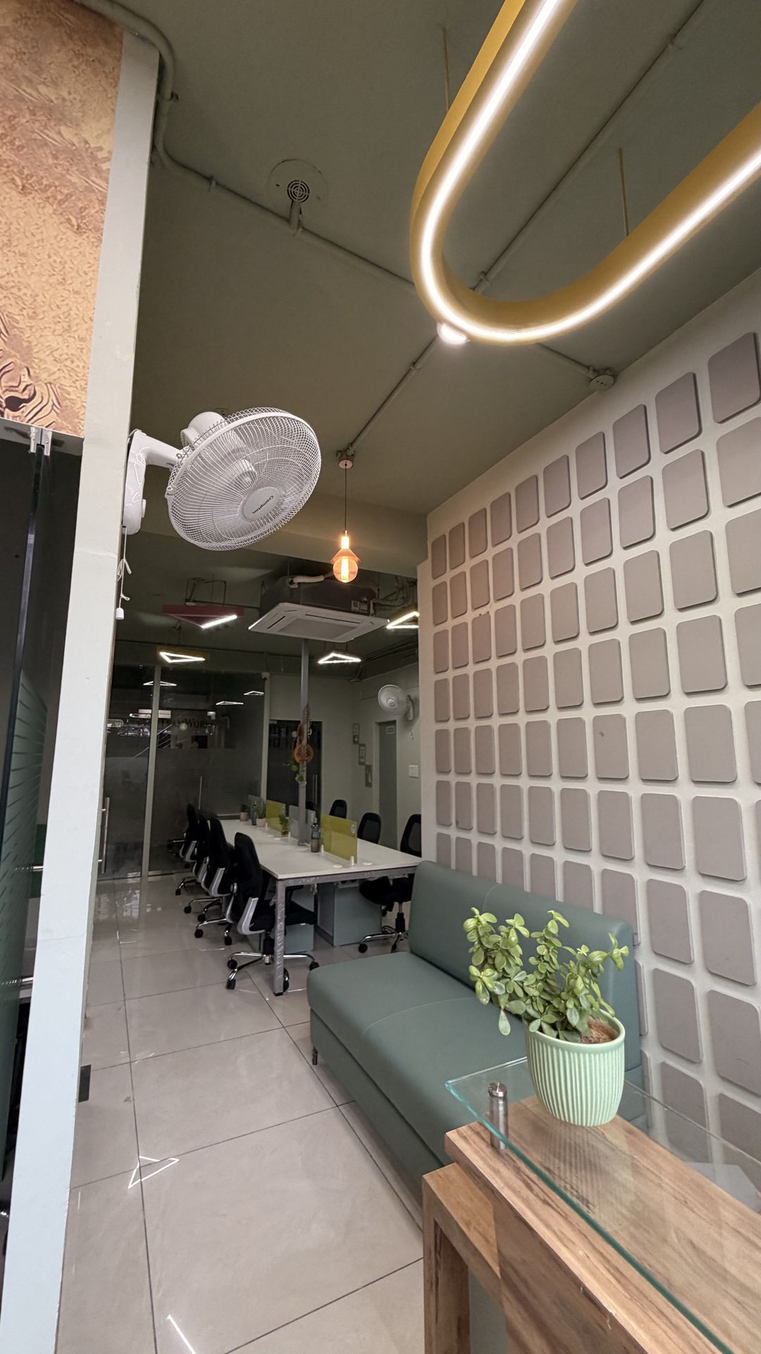 Karmhut coworking common area with feature wall and lounge seating