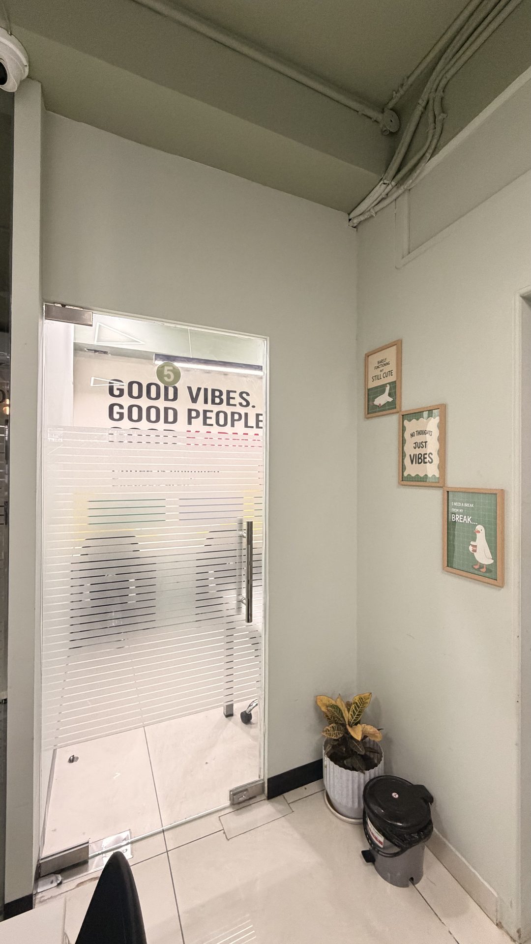 Frosted glass cabin doorway with Good Vibes branding