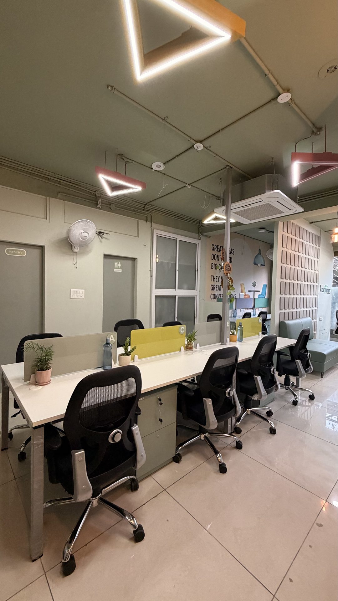 Karmhut open shared workspace desks with colourful accent lighting